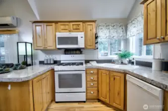 PROPANE STOVE, MIRCROWAVE, DISHWASHER AND REFRIGERATOR,  GREAT CORNER SINK WITH LARGE WINDOWS