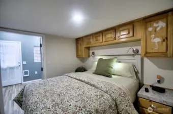 PRIMARY BEDROOM WITH BUILT IN CABINETS AND READING LIGHTS