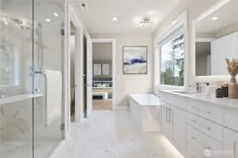 Sumptuous bathroom features large soaking tub and walk in tiled shower.
