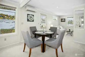 Dining room with family room beyond.  Note the mini-split which provides heat in the winter and cooling in the summer.