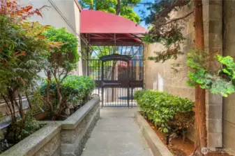 A quiet transition from the vibrant city outside to your private retreat inside through the secure gate.