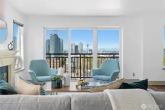 Cozy up by the gas fireplace and take in city views through French balcony and oversized windows.