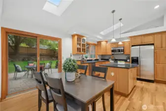 Kitchen flows easily to paver patio and huge back yard.