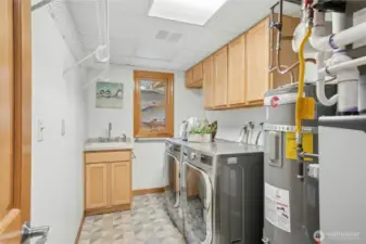 Bright and open laundry room plus powder bath.