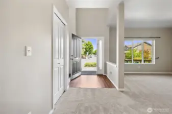 Main entry with tall ceilings and LVP flooring.