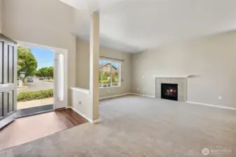 Sizable living room with cozy gas fireplace. All new carpet on lower level.