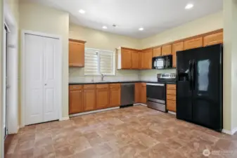 Open kitchen with all new vinyl. All appliances stay.