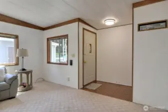 Front foyer steps into the living room where you'll find fresh paint throughout the home.