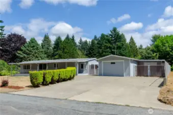 Detached one car garage has additional shed space for all your tools and toys. The oversized paved driveway provides loads of extra parking space for RV or boat.