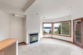 Lower level studio space with outdoor access, gas fireplace and more views!