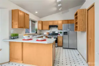 Kitchen offers stainless appliances, pantry, and efficient layout.