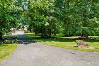 Long paved driveway leads to private & secluded residence.