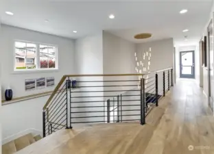 The upstairs landing includes this incredible raindrop chandelier.