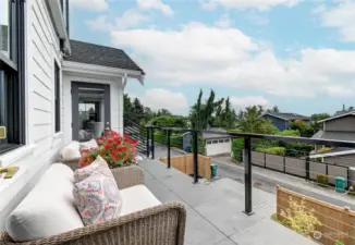 The Juliet balcony with access from the primary bedroom and the family room is a great place to relax.