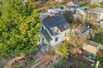 Solar panels have been installed on both the main house and the additional studio. This provides a wonderful view of the Juliet balcony on the upper level.