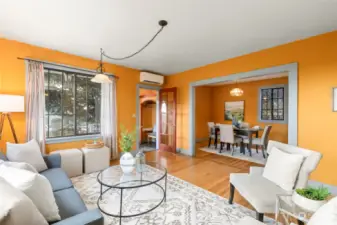 View of front door entry into the living room and dining area.  Actually, the dining area has been used for an additional living area.