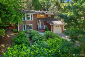 Front view on an angle.  The front even has walking paths through the rhodedendrons.