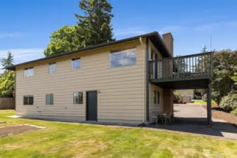 Back yard and back of house with carport
