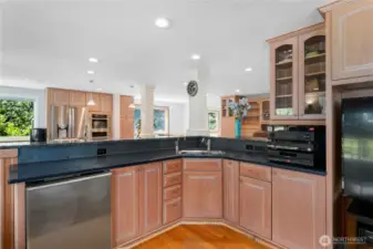 Wet bar area with mini fridge and Blanco double sink