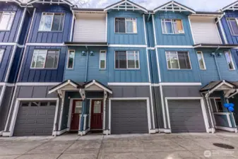 Front entry to left next to your PRIVATE TANDEM GARAGE.  Perfect lock it & leave it lifestyle!  Close to the Art District, UW Tacoma Campus, Brewery District & commuter station.