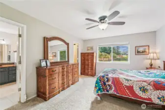 Primary bedroom suite is bright and spacious.