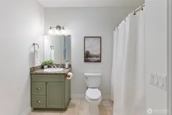 Full bathroom off the utility room (and three car garage).