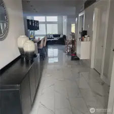 Walking into the house.