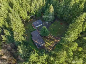 Arial View of home, shop, well house, covered rv parking and pull through driveway.