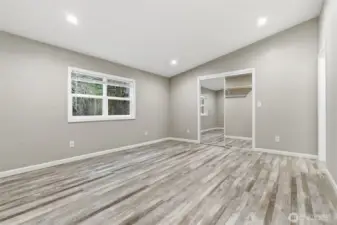 Very spacious primary bedroom with walk-in closest and 5 piece bathroom.