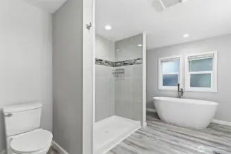 Primary bathroom. Large walk-in shower, and beautiful stand alone tub.