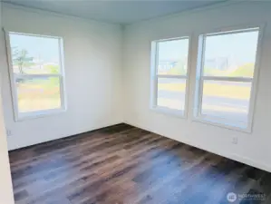 Flow from the kitchen into this spacious dining area.