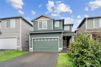 Home is nestled in a quiet neighborhood of well-maintained homes and community grounds.