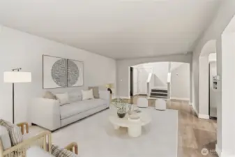 Another view of the living room looking out to the front entryway with soaring two-story ceiling. (Virtual Staging)