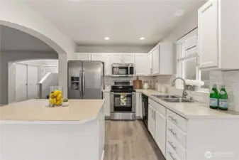 Pull up bar stools for center island dining and enjoy instant hot meals straight from the stove top.