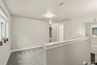 At the top of the upstairs landing, to your left is the spacious loft area, versatile as a WFH space, entertainment center or reading nook. All new plush carpeting throughout.
