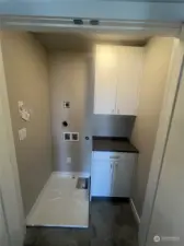 Laundry room conveniently located next to bedrooms