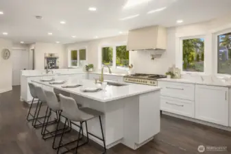 The kitchen, true heart of the home, offers both aesthetic and convenience by its sizable, open feel and its large island: perfect for homework, casual eating, computer work, and cooking.