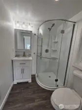 Brand new 3/4 bath off kitchen and mud room, and back door.