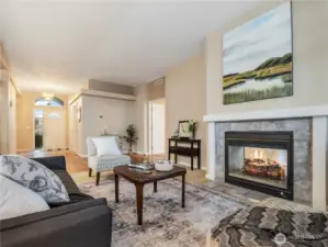 The open great room is the perfect spot to gather for cozy conversations by the fireplace.