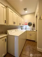 Oversized Laundry, complete with ample storage and utility sink.