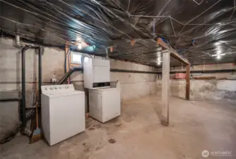 Basement level with washer and dryer.