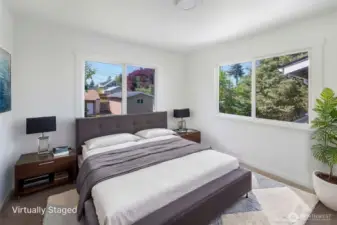Nice bedroom with new carpet that faces spacious backyard.