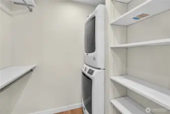 Full-sized stackable W & D within the walk-in closet.
