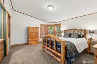 Primary Bedroom with walk in closet, built in dressing table and a primary bath