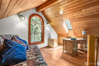 Loft upstairs offers an office and abundant storage.