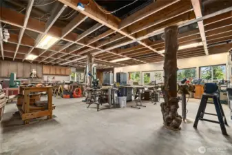 Over 1,700 sq ft of unfinished basement currently serves as a workshop and storage area—offering endless potential.
