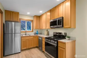 Kitchen features Brand-new Countertops, Sink/Faucet, Garage Disposal, and Samsung Stainless-Steel appliance package including Gas Range.
