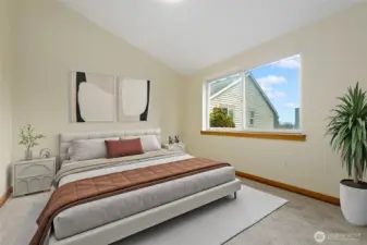 One of two large Bedrooms upstairs with both having Vaulted Ceilings.  This Room is on the East side and features a double Closet.