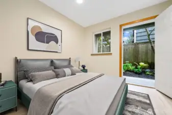 Lower-level Bedroom works great either as a Guest space, or a home office.  This Bedroom has access to the private, fenced patio and plant Garden.