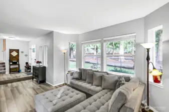 Large living room with bay window for added natural light.